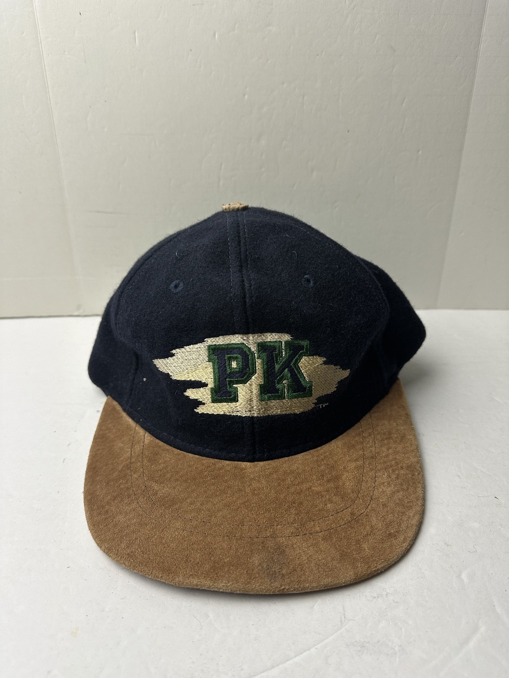 Vtg PK embroidered navy cap with tan suede brim and leather strap